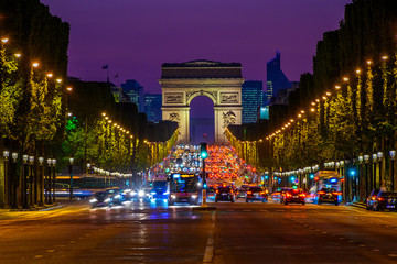 Fototapeta na wymiar Champs-Elysees and Arc de Triomphe at night in Paris, France
