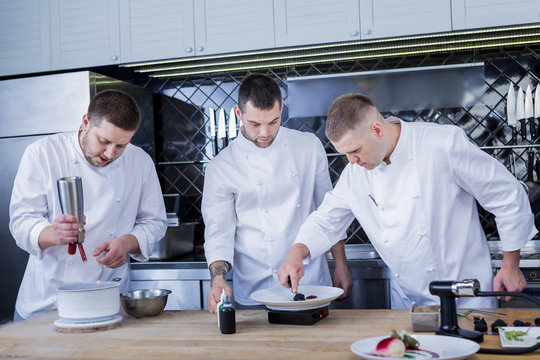 Several cooks. Best young cooks feeling motivated while dealing with molecular gastronomy