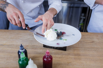 Another dessert. Young creative cook feeling confident while preparing another dessert