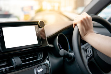 Male driver hand holding on steering wheel using digital dashboard monitor for GPS navigation on...
