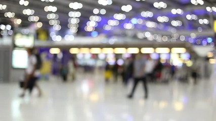 blurred people in airport.