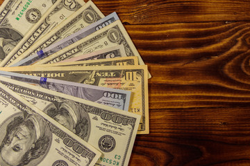 American dollars on wooden background. Top view, copy space