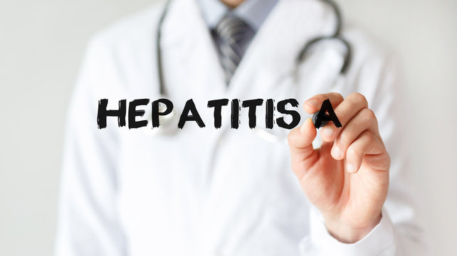 Doctor writing word Hepatitis A with marker, Medical concept