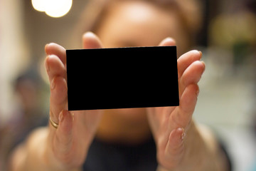 business card in hand