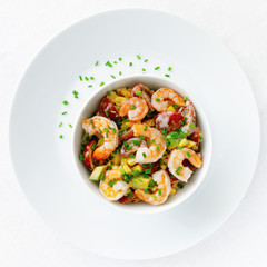 salad with steamed prawns, cherry tomatoes, corn, and avocado dressed with mayonnaise and decorated with green onion