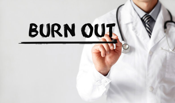 Doctor writing word Burn Out with marker, Medical concept