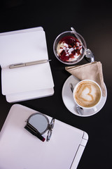 Woman's tabletop with yoghurt and cereals. Morning meal. Top view shot.