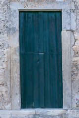 Fototapeta na wymiar Old blue door in a village