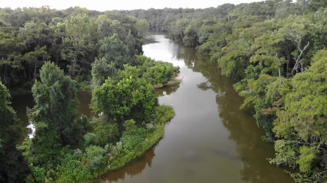 Tree top to water level drone footage on the San Jacinto River near Houston, Texas