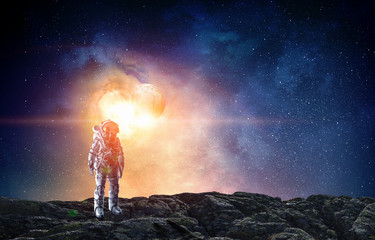 Spaceman landing planet. Mixed media