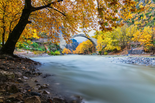 Old stone bridge in Konitsa and Aoos River an autumn day,Epirus, Western Greece. (Soft Focus) Long exposure using ND filter