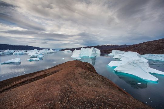 massive Icebergs floating in the fjord scoresby sund, east Greenland 
