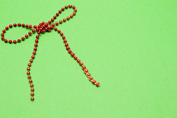 holiday decoration.  bow and red beads  