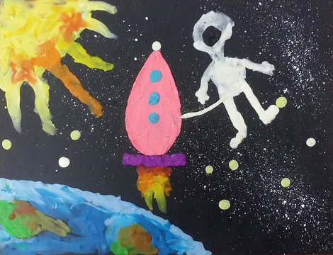 The astronaut about the spaceship in an outer space. Plasticine applique