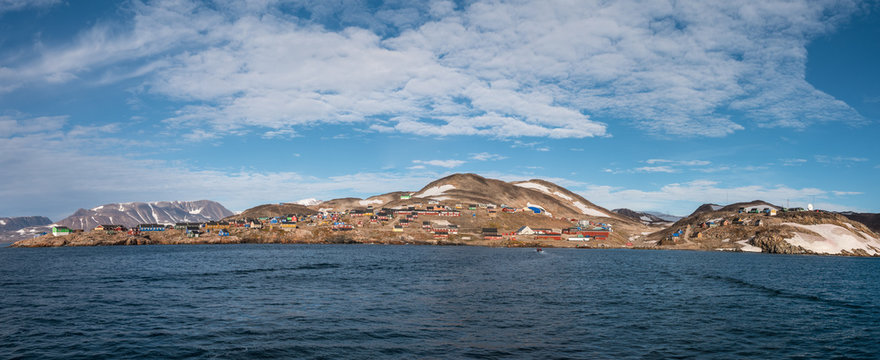 settlement of Ittoqqortoormiit with colorful houses, eastern Greenland at the entrance to the Scoresby Sound fjords - panoramic view