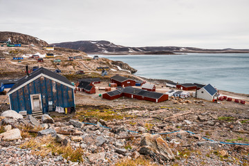 settlement of Ittoqqortoormiit with colorful houses, eastern Greenland at the entrance to the...