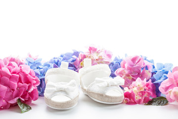 Cute newborn baby girl shoes. Baby shower, birthday, invitation, greeting card