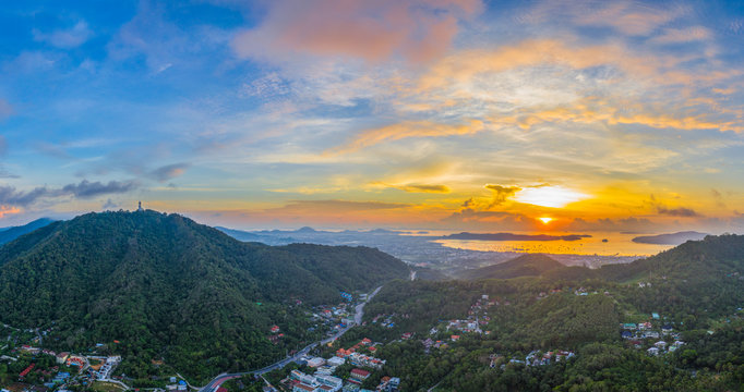 aerial view sunrise in Chalong sea Phuket big Buddha is on the top of Nakkerd mountain.Phuket big Buddha is the famous landmark in Phuket island  a lot of tourists visiting this landmark every day