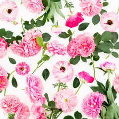 Floral pattern of roses flowers and leaves on white background. Flat lay, top view. Natural composition.