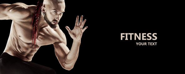 The fit man doing weight lifting in gym on black background. The fitness, training, sport, workout, exercise, athlete, healthy lifestyle concept