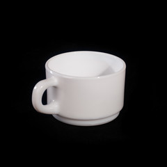 A white mug on a black background