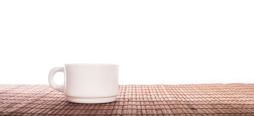 White crockery on a bamboo Mat
