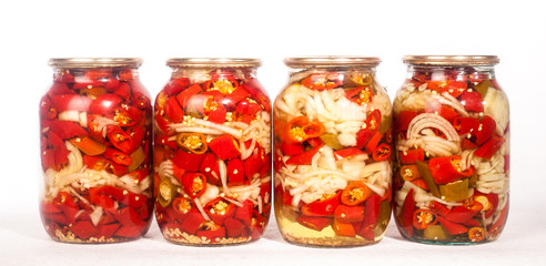 collection set of canned vegetables in glass jars isolated on white background