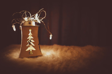 Christmas lights glowing in a dark, background with rustic lantern and lights