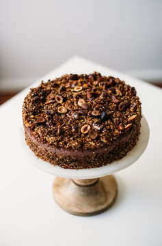 Homemade gluten free, vegetarian сarrot, banana and nuts Cake on white marble background