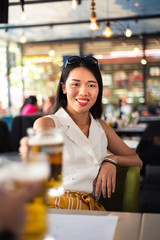 Girl having a beer in the bar