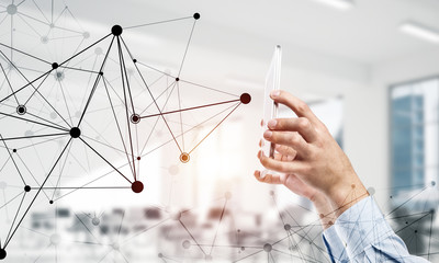Business and technology concept with networking grid and man usi