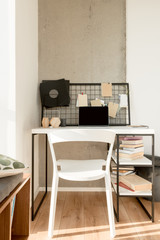 close up view of laptop with blank screen on table at home office