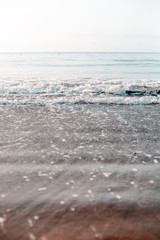 Close-up of sand and waves