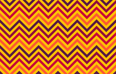Abstract chevron lines in red to orange hues on yellow background, graphic resource as geometric background, textile print, wallpaper and geometric inspiration