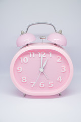 pink clock and white background