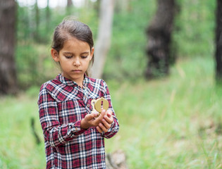  Young traveller. Small girl with compass . © volff