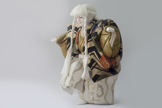 Clay doll of japan of Hakata-ningyoo in Black and Gold color uniform.
