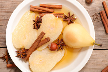 poached pear with syrup and spices