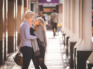 Close up image of a same sex female / lesbian couple enjoying sightseeing in the Cape Town South Africa city Center