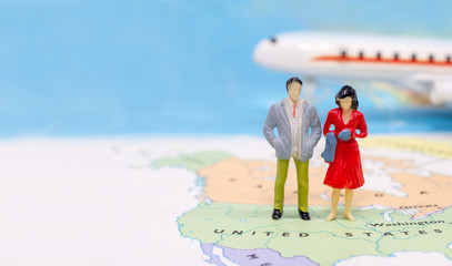 Miniature people, Couple standing on map American