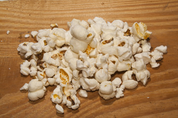 popcorn isolated on a wooden background