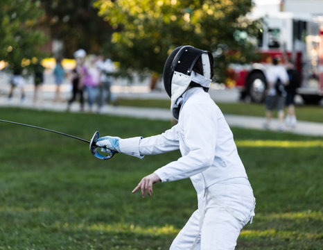 Fencing athlete in attacking position