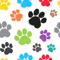 Fototapeta premium Seamless pattern with colorful silhouette animal paw track on white background. Vector illustration