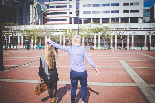 Close up image of a same sex female / lesbian couple enjoying sightseeing in the Cape Town South Africa city Center