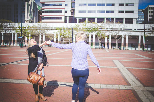 Close up image of a same sex female / lesbian couple enjoying sightseeing in the Cape Town South Africa city Center