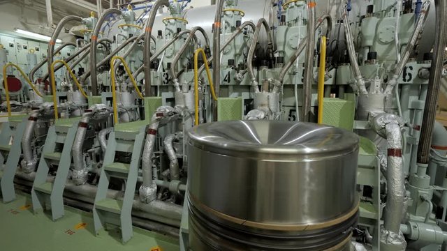 New piston close to marine diesel in engine of ship