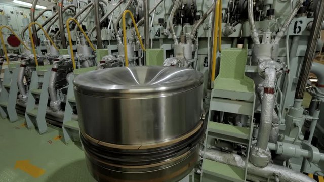 New piston of large marine diesel in engine room of ship
