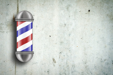 Barber pole against a gray concrete wall. Copy space. Concept Barber Shop.