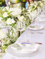 Set table for a white and aqua blue wedding dinner decorated