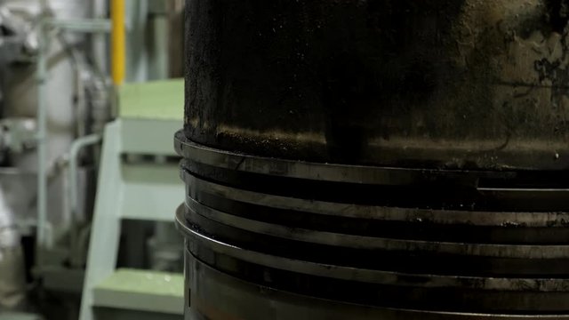 Piston rings on used piston of large diesel engine